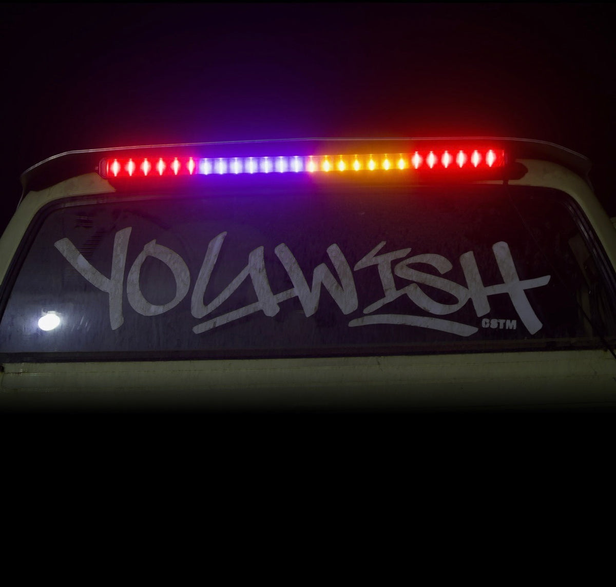 YouWish chaser light bar lit in full colour above the rear window banner